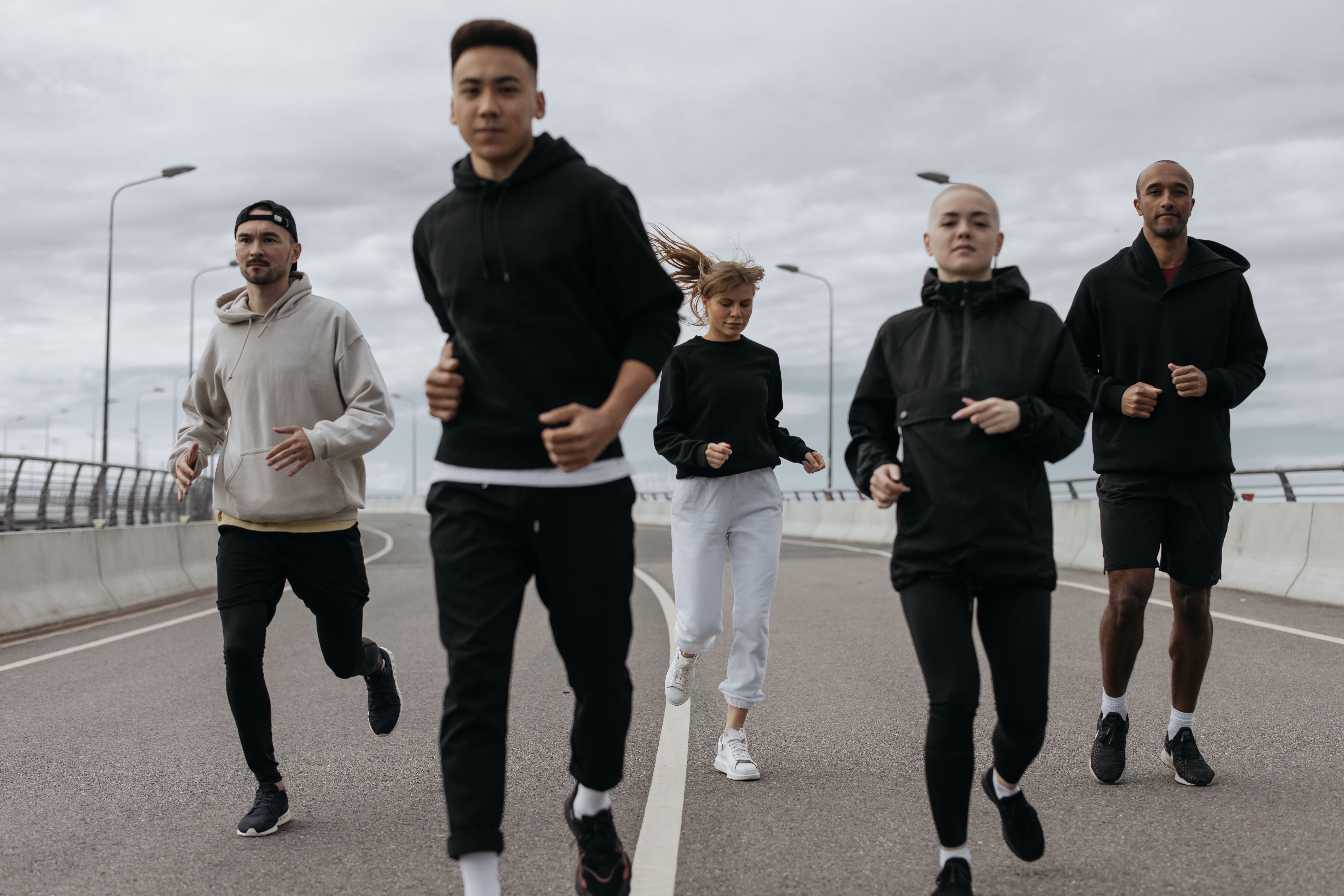 Group running together — illustrative stock photograph, not the fictional interview or club