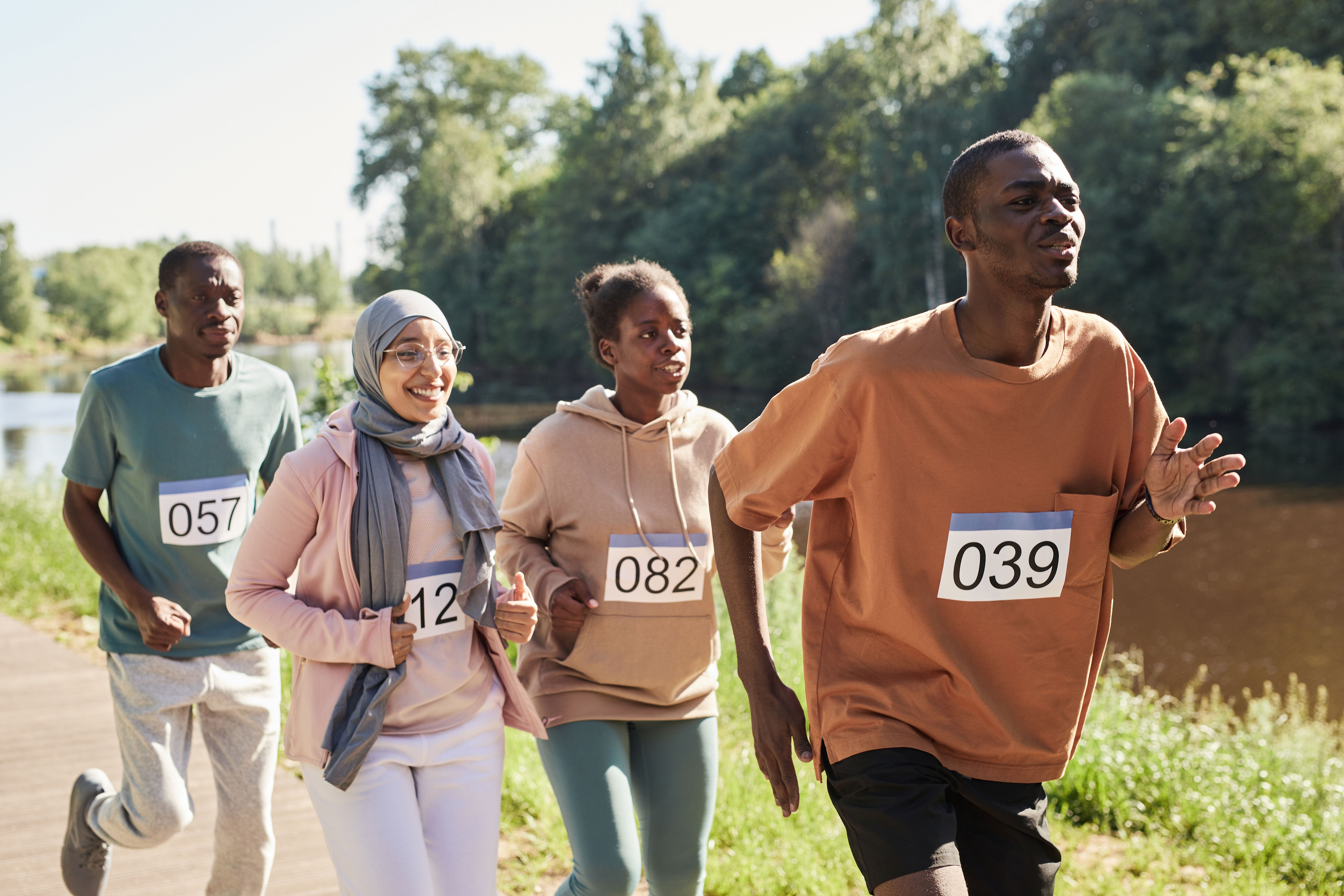 Four runners participating together outdoors